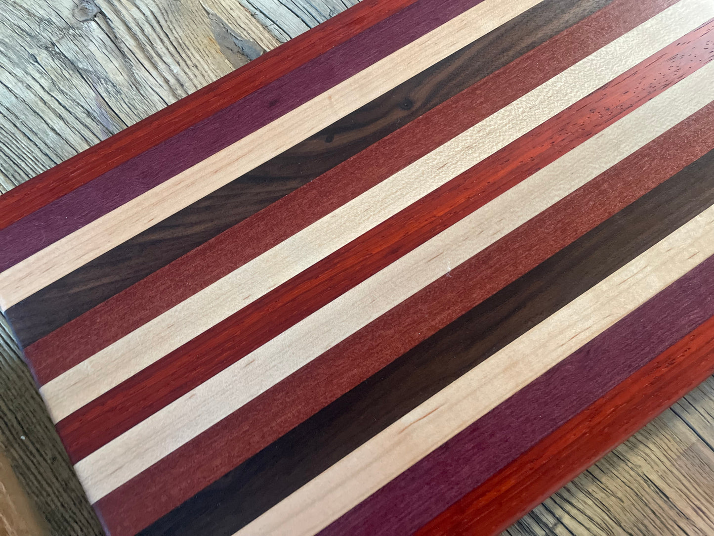 24M024 - Mixed Padauk, Purpleheart, Maple, Santo Mahogany & Black Walnut Board