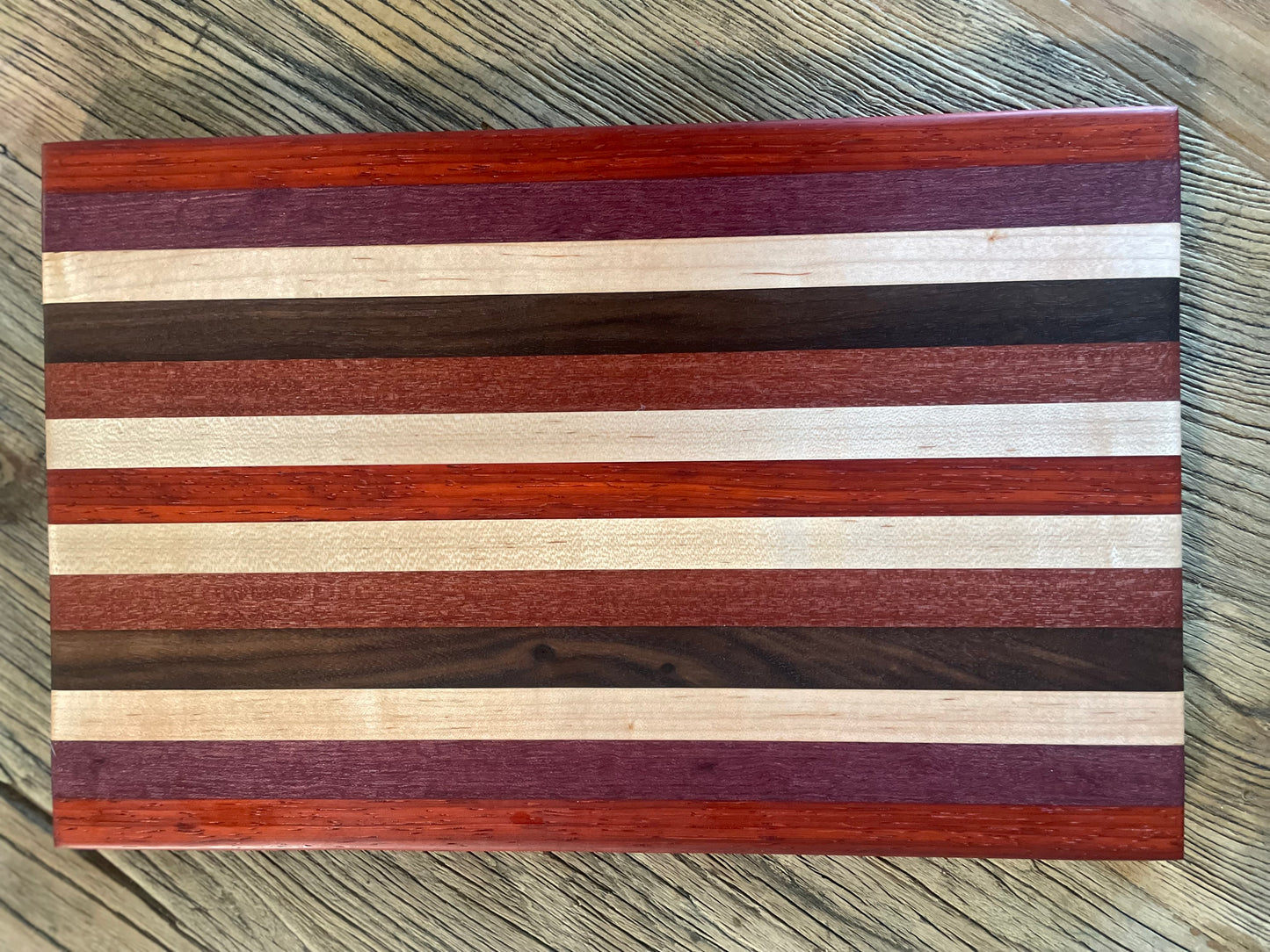 24M024 - Mixed Padauk, Purpleheart, Maple, Santo Mahogany & Black Walnut Board