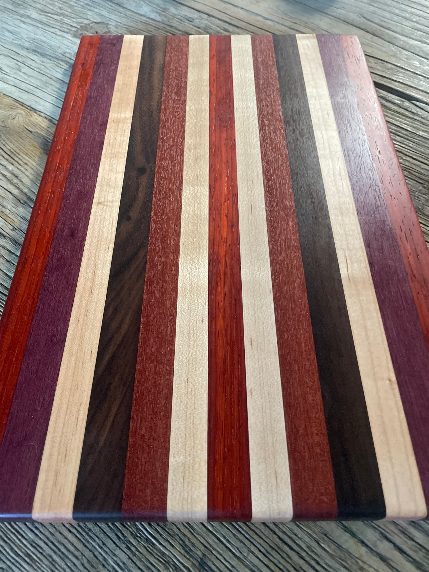 24M024 - Mixed Padauk, Purpleheart, Maple, Santo Mahogany & Black Walnut Board